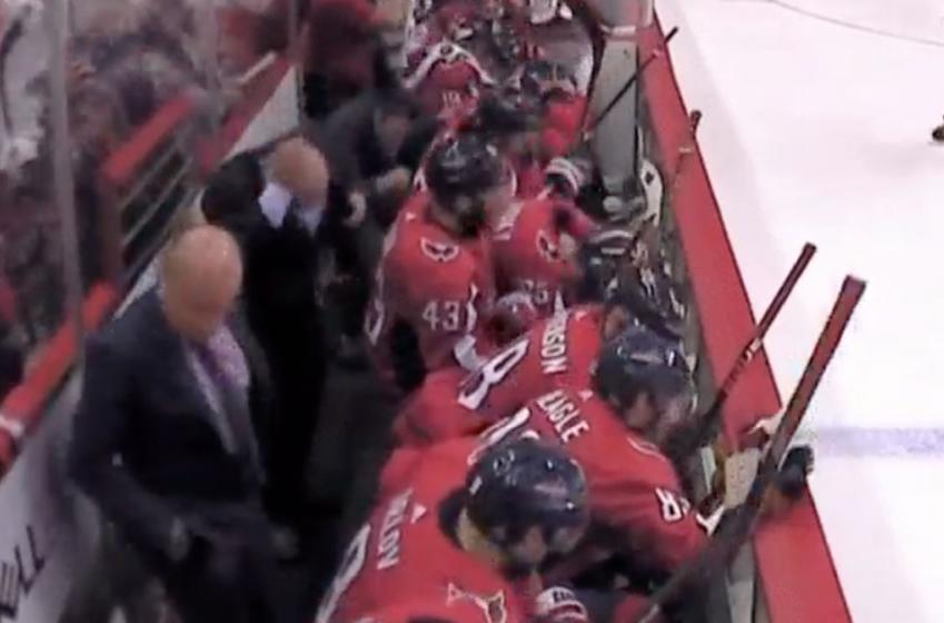 Breaking: Coach Trotz gets hit by a hard shot behind the bench... 